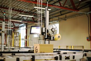 Print-and-Apply Labeling Machine in distribution center